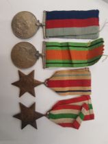 A collection of world war medals to inlude WW2, The defence medal, The Africa star and the Italy