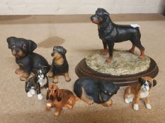 A collection of pottery and resin dogs to include Royal Doulton Spaniel K9, unmarked bulldogs, and