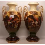 A pair of twin handled vases depicting rural scences 39cm in height
