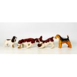 Four Beswick dogs to include Lakeland Terrier 2448, Cocker Spaniel 1754, Caught it 2951 and Juggling
