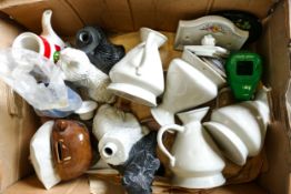 A collection of Wade Jugs , Money Box, Door Plaques etc .These items were removed from the