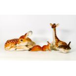 A collection of Russian ceramic figures to include large seated deer, giraffe, small squirrel and