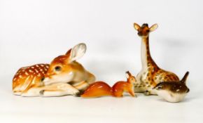A collection of Russian ceramic figures to include large seated deer, giraffe, small squirrel and