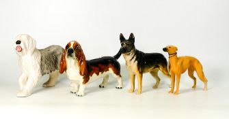 Four Beswick Dog figures to include Champion Ulrica of Brittas, Foot Marksman of Allways, Old