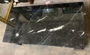 A Modern Marble Table on four Triangular Legs. Height: 38cm x Length: 130cm x Width: 70cm