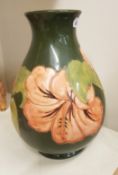 Walter Moorcroft Hibiscus on green ground Vase height 21cm