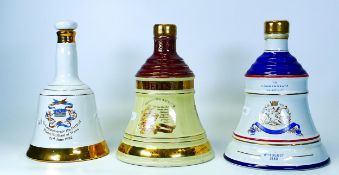 Three Un Sealed Bells Pottery Whiskey Decanters including Royal Commemorative & Christmas Theme