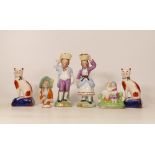 A collection of Reproduction Staffordshire type figures including fruit carriers, cats , pin cushion