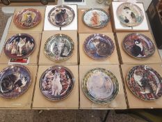 A collection of decorative wall plates, Danbury Mint 'Cats Around the World' series (12)