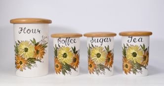 A Set of Four Crown Devon Storage Jars; to include jars labelled Flour, Tea, Coffee and Sugar (4)