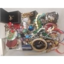 A collection of vintage and modern costume jewellery to include ladies watches, necklaces,