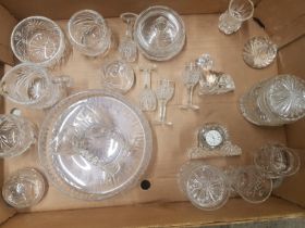 A collection of Crystal ware items to include small waterford clock, crystal vases, paperweights,
