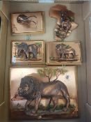 A collection of African souvenier ware copper wall hanging plaques, depicting Lions, Elephants