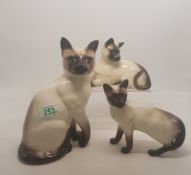 A group of three Beswick Siamese car figures to inclue 1882, 1558 and standing cat (3)