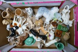 A collection of items to include Sylvac dogs, animals, Train Egg Set, Crown Devon Puppy, Bswick