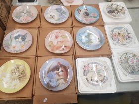 A collection of decorative wall plates, 8 Purrs and Petals series together with 4 Royal Albert