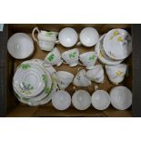 Two China Teasets to include an 18-piece handpainted Collingswood set and a 17-piece Windsor set (