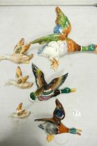 A collection of Wild Bird Theme Mid Century Wall Plaques, largest length 35cm(6)