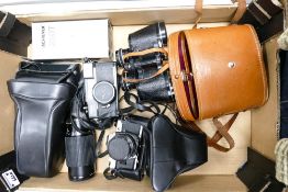A collection of Vintage Camera Equipment to include Olympus OM10 film camera, 50mm lens fitted,