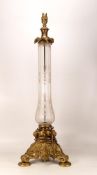 Glass and gilt brass lampbase. Gilt brass collar decorated with leaves with a clear/frosted glass