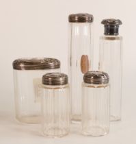 Five x matching hallmarked silver (London 1907) topped dressing table cut class jars. Silver and