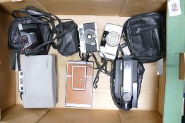 A collection of vintage camera equipment to include Polaroid SX-70 land , Polaroid 320 ,Pentax pc35,