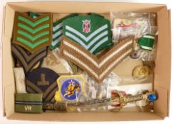 A collection of military related items including cloth badges, medals etc
