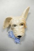 Beswick Sealyham wall plaque 373, bow on left, cream dog with blue bow
