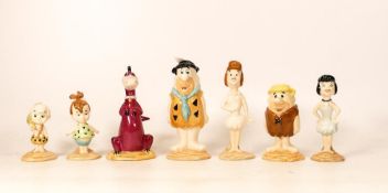 A collection of Beswick Flintstones figures Fred and Wilma, Pebbles Flintstone, Barney and Betty,