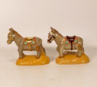 Two Wade Beside the Seaside donkeys, one with gold highlights . Height 9cm.This was removed from the