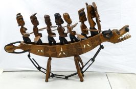 Large Nigerian Inlaid Wooden Carved Boat. An unusually large tribal souvenir work, Seven Men and