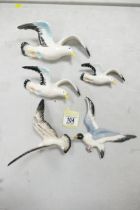 A collection of Mid Century pottery Seagull theme wall plaques, largest length 19cm(5)