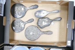 A collection of Silver & White Metal Distressed Dressing Table Mirrors & brushes