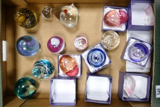 A collection of glass paperweight to include Caithness four seasons, creatures great and small,