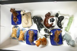 A collection of Wade dog figurines to include boxer on cushion, Shep, St Bernard etc. Two have