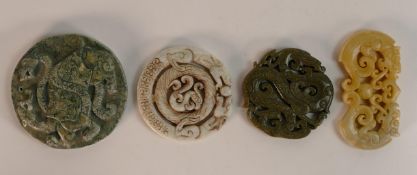 A collection of Chinese carved hardstone roundels in different colours, largest d.8.5cm. (4)