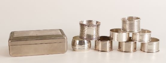 A collection of Silver serviette rings, 150g, together with a metal jewellery box.