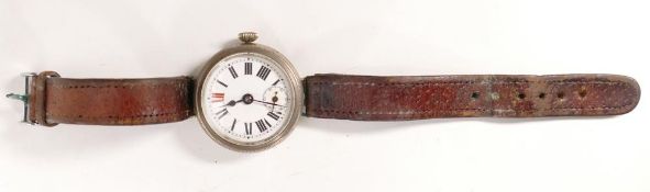 WWI period trench type wrist watch in base metal case, measuring 42mm wide inc. button. Winds,