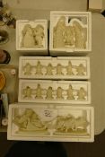 A collection of Boxed Department Branded Snow babies figures (5)