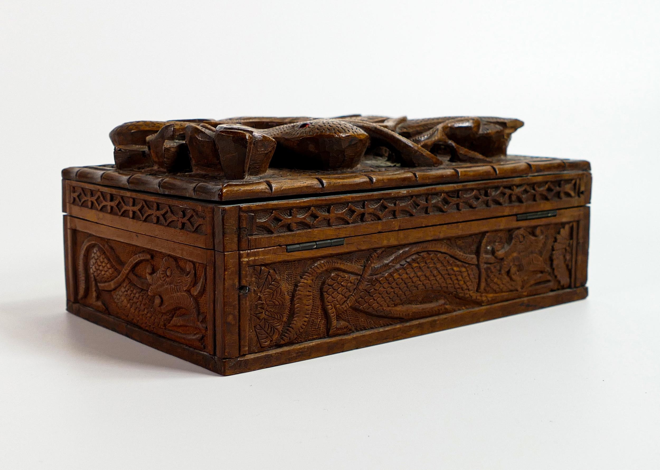 Early 20th century wood box, carved all around with dragons, small piece of carving missing top left - Image 3 of 7