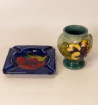 Moorcroft Hibiscus footed vase on green ground together with a Hibiscus ashtray on blue. Height of