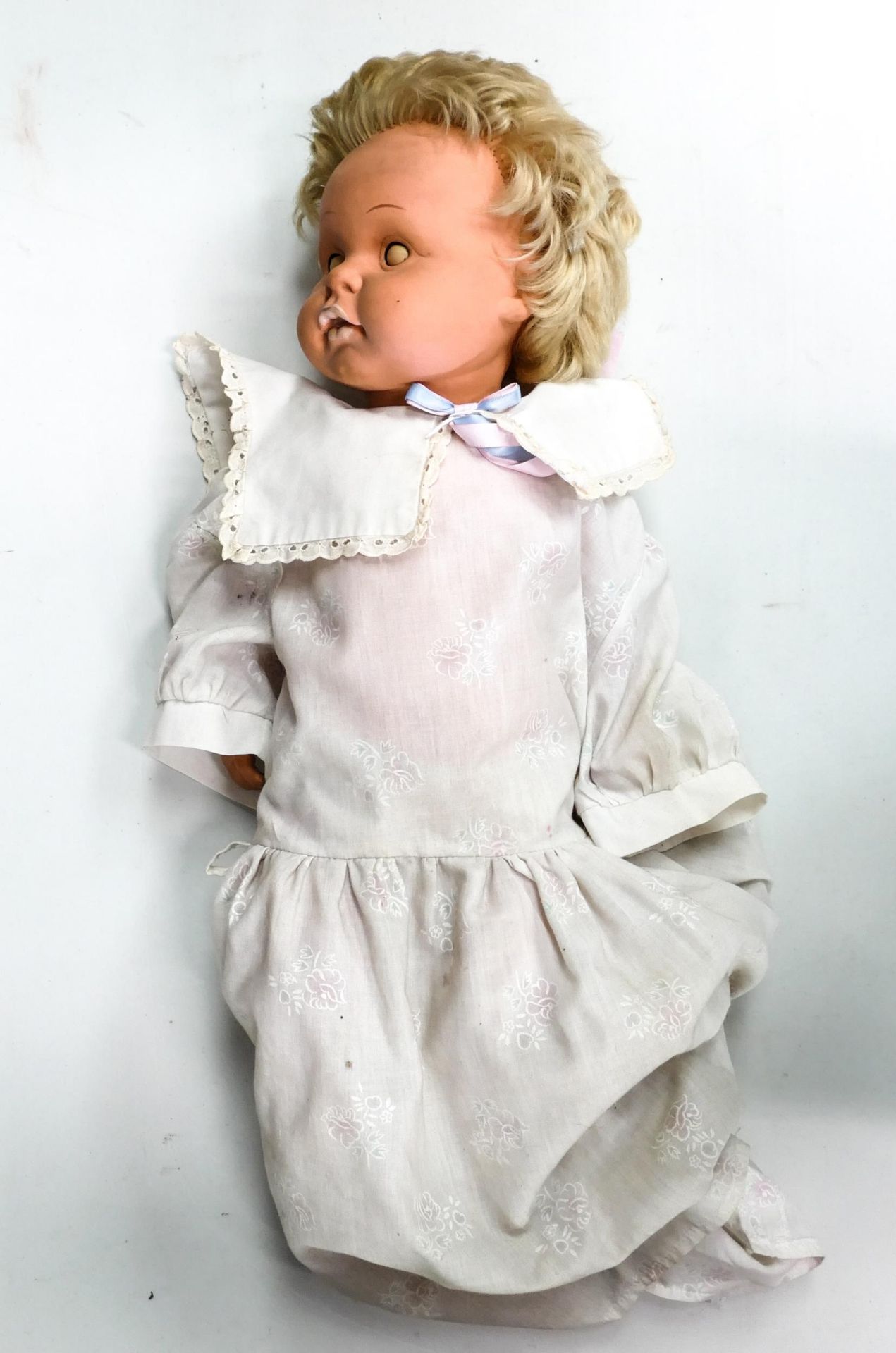 Very large mid century rubberised blonde doll, mould marks 60 87 to back of neck. 60 cm long.