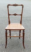 Victorian Rattan Chair with Brass Shield Insets. Height: 85cm