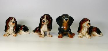 Four Sylvac & Similar Comical Dog Figures, tallest 11.5cm together with Cooper Craft Models of