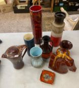 A collection of vintage art pottery, including vases, dishes in various colours, tallest vase