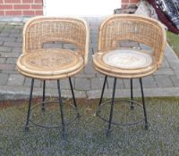 Pair mid-century wicker revolving stools on wrought iron supports. (2)