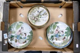 A collection of Oriental Theme 20th Century Wall Plates together with a collection of Asian plates