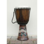 An African Bongo Drum with skin top and painted decoration. Height: 61cm
