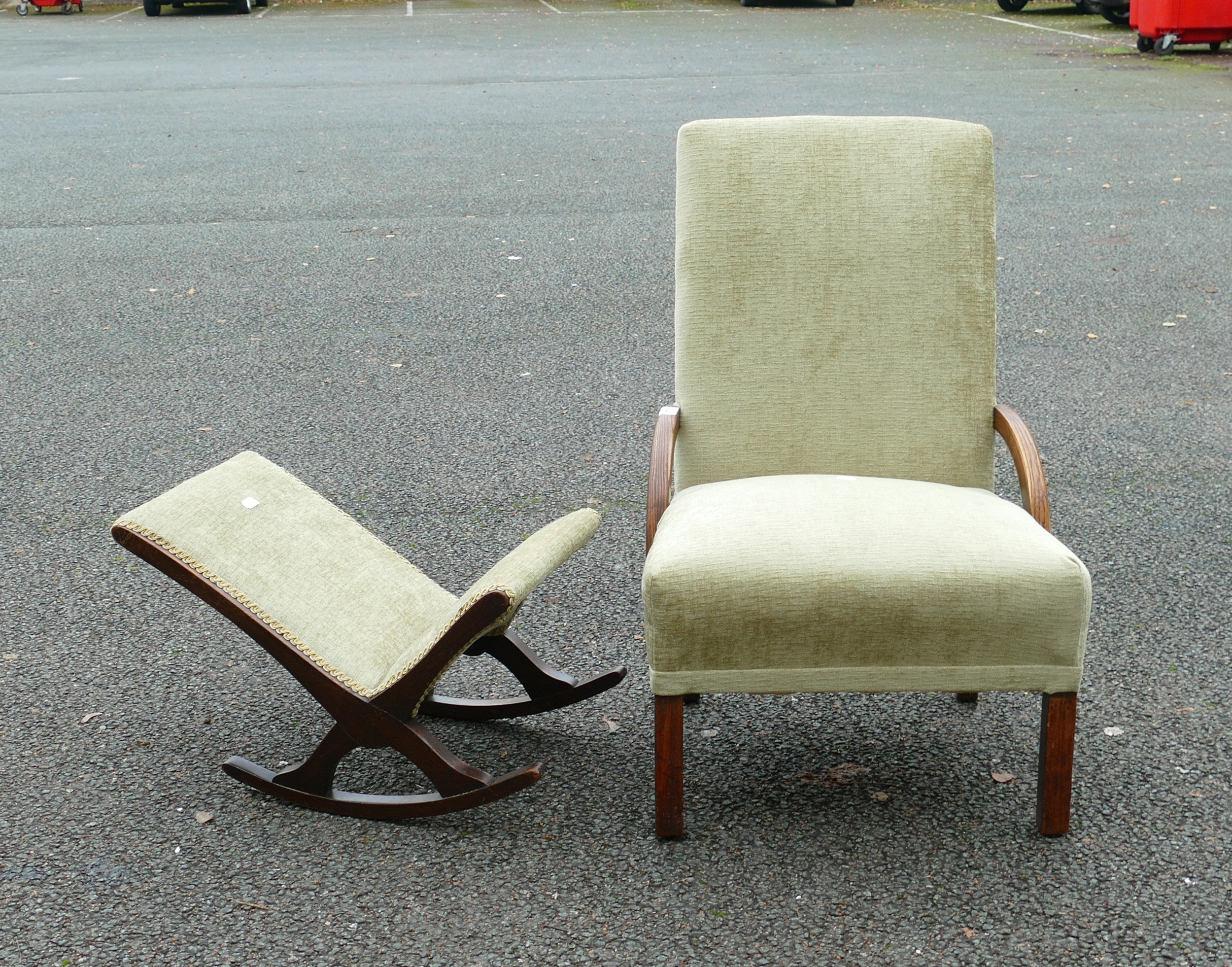 An Upholstered Chair with Low Arm Supports together with a small rocking Footstool. Height of