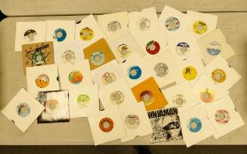 A collection of 44 1980's & later 7" Vinyl records including reggae, ska & dub, modern & vintage